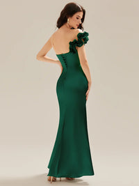 Emerald green strapless formal dress with fishtail and ruffles.