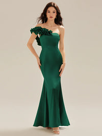 Emerald green strapless formal dress with fishtail and ruffles.