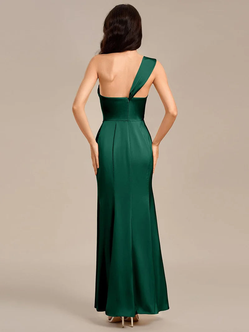 Emerald green satin formal dress or bridesmaid dress in an off shoulder  design with a split.