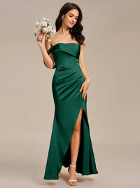 Emerald green satin formal dress or bridesmaid dress in an off shoulder  design with a split.