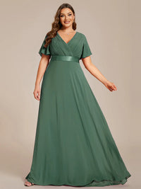 Eucalyptus green  plus size bridesmaid dress or formal dress in chiffon with short sleeves and a satin band.