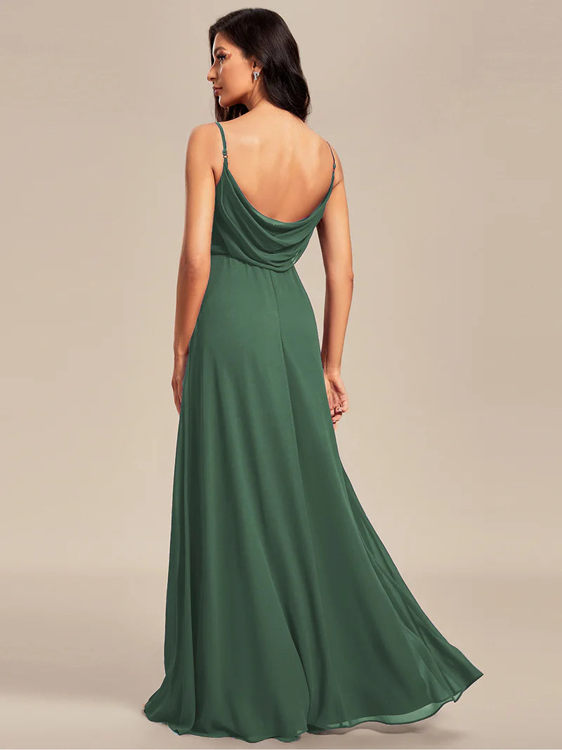 Sleeveless eucalyptus bridesmaid dress with spaghetti straps.