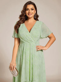 Floral green plus size mother of the bride chiffon midi dress.