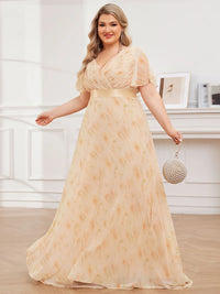 Floral peach plus size bridesmaid dress or formal dress in chiffon with short sleeves and a satin band.