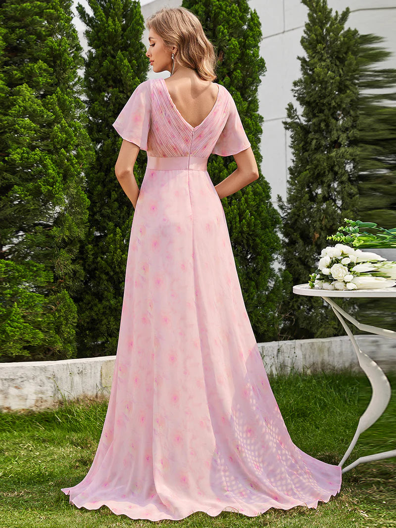 Floral pink formal dress in chiffon with satin band and short sleeves.