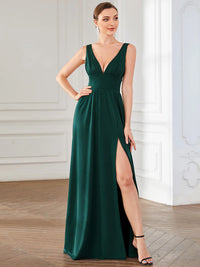 Dark green sleeveless formal dress with deep v neck and front split.
