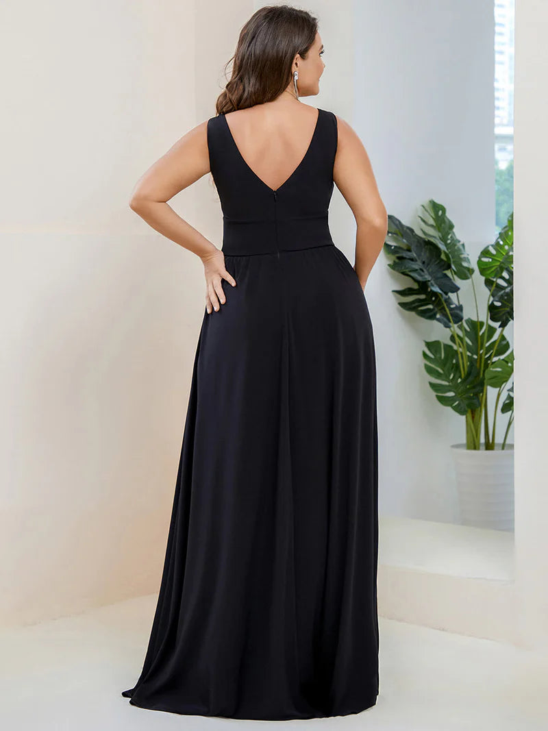 Plus sized black formal dress with sleeveless and deep v-neck.