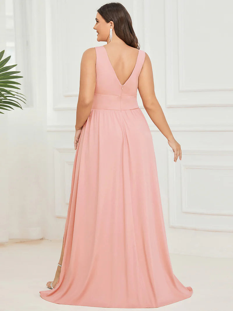 Plus sized pink formal dress with sleeveless and deep v-neck.