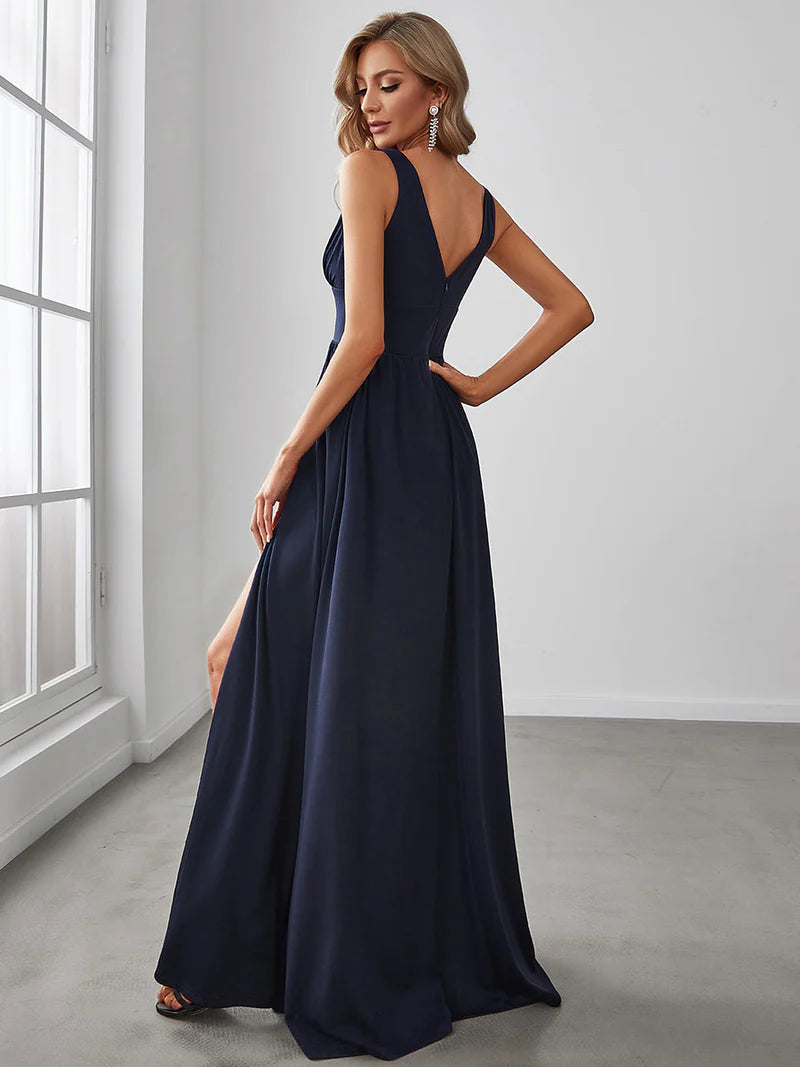 Navy blue sleeveless formal dress with deep v neck and front split.
