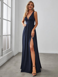 Navy blue sleeveless formal dress with deep v neck and front split.