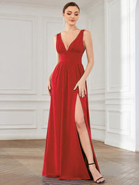 Red sleeveless formal dress with deep v neck and front split.