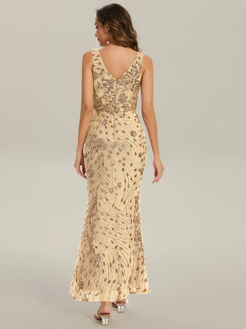 Gold formal dress with deep v neck and a split.