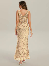 Gold formal dress with deep v neck and a split.