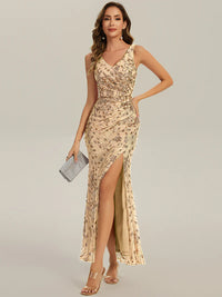 Gold formal dress with deep v neck and a split.