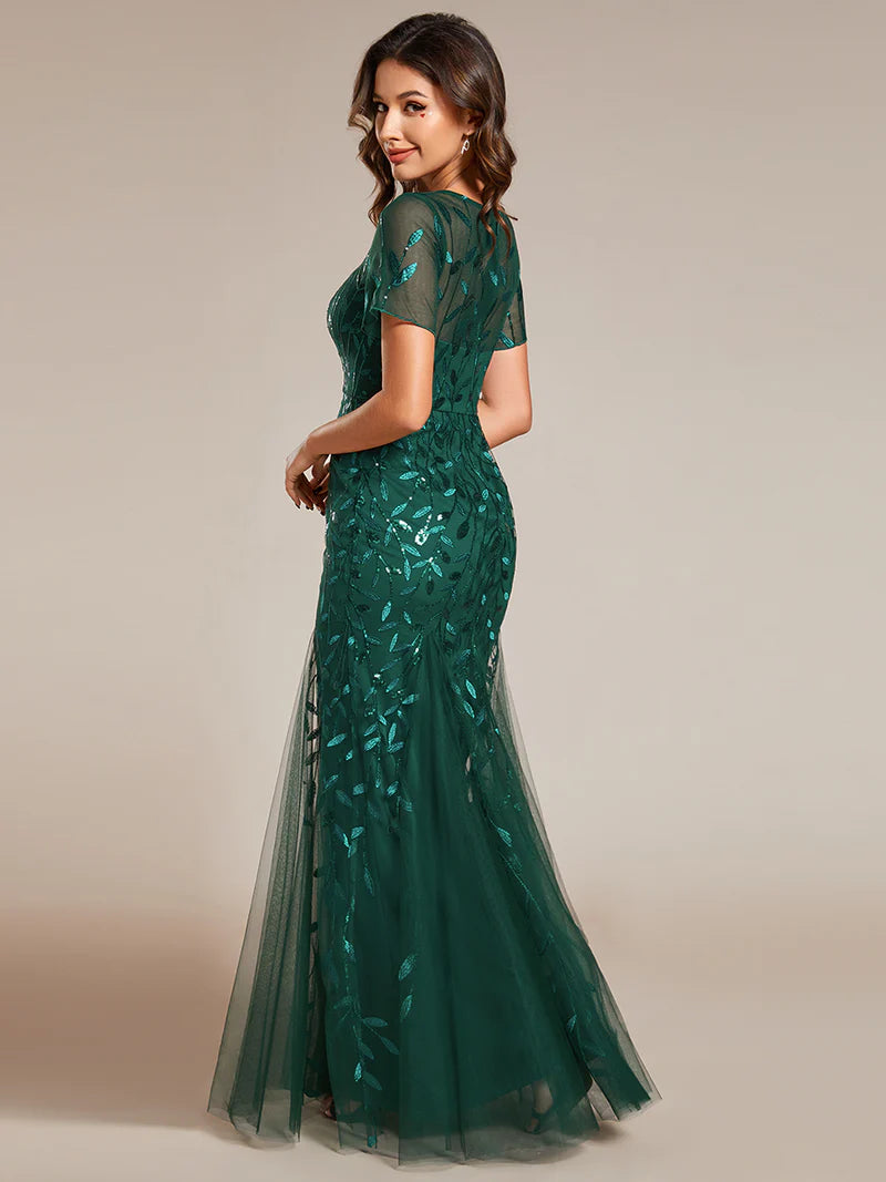 Green Mother of the bride dress, short sleeve with tulle, lace and sequin detailing.