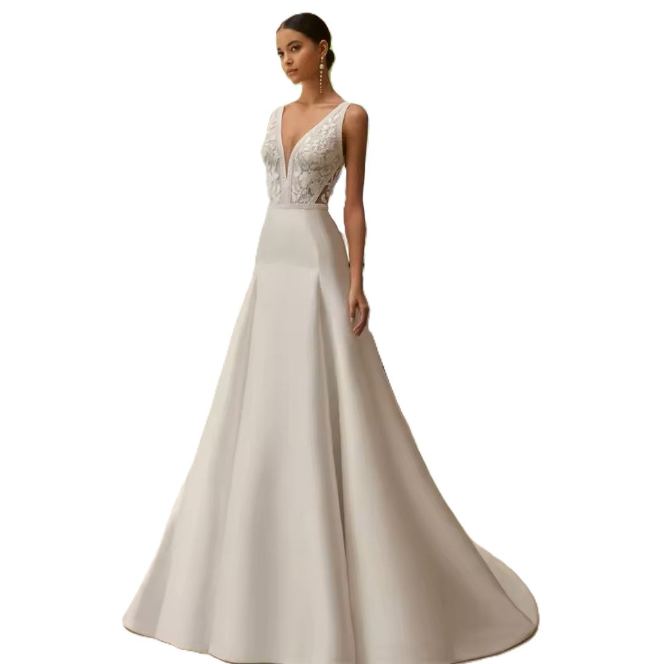 Ivory Lace and Satin wedding dress with button detail.