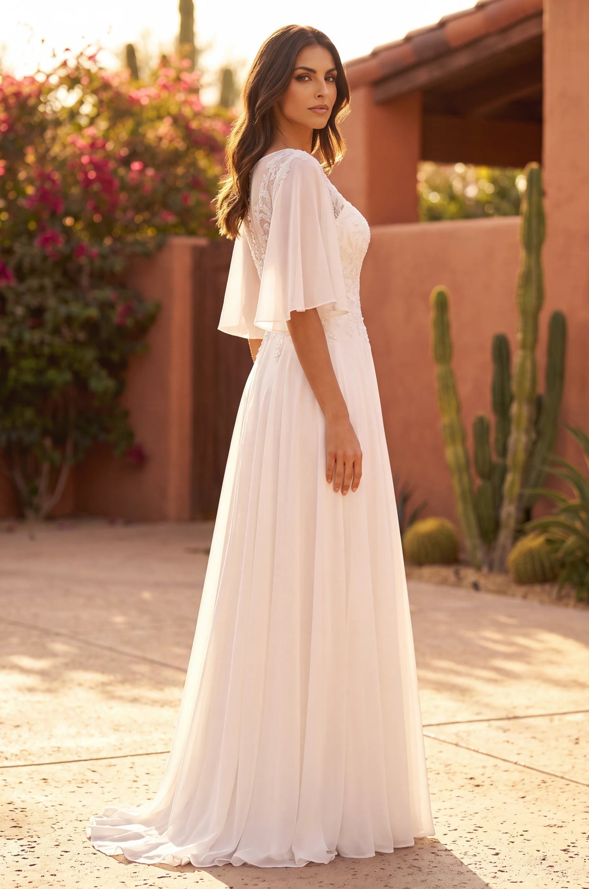 Ivory plus size wedding dress in chiffon with beaded bodice.
