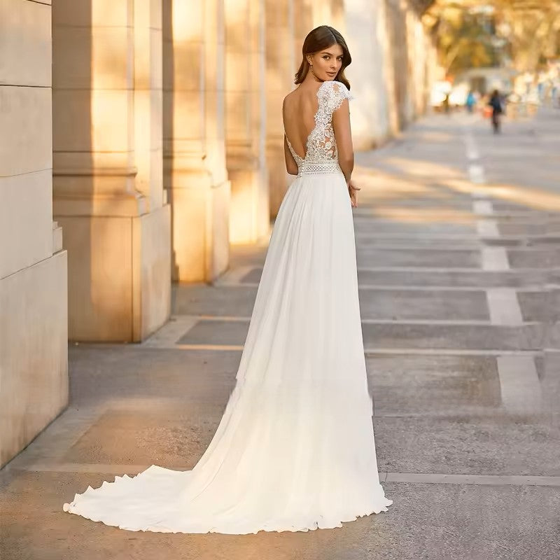 Ivory wedding dress in lace and chiffon.