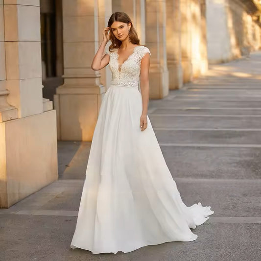 Ivory wedding dress in lace and chiffon.