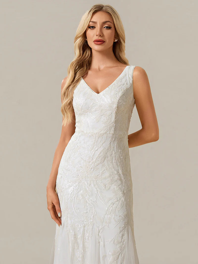 Ivory wedding dress sheath style with sequins and tulle.