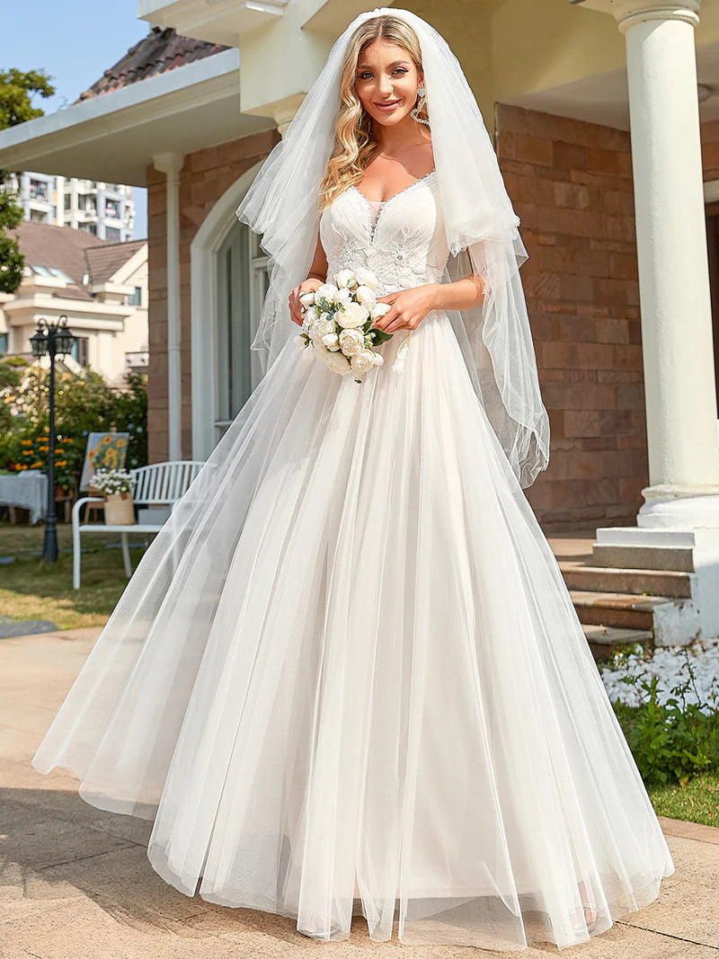 Ivory wedding dress with tulle skirt and lace applique bodice.