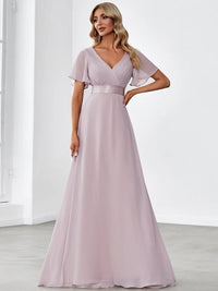 Lilac bridesmaid dress or formal dress in chiffon with satin band and short sleeves.