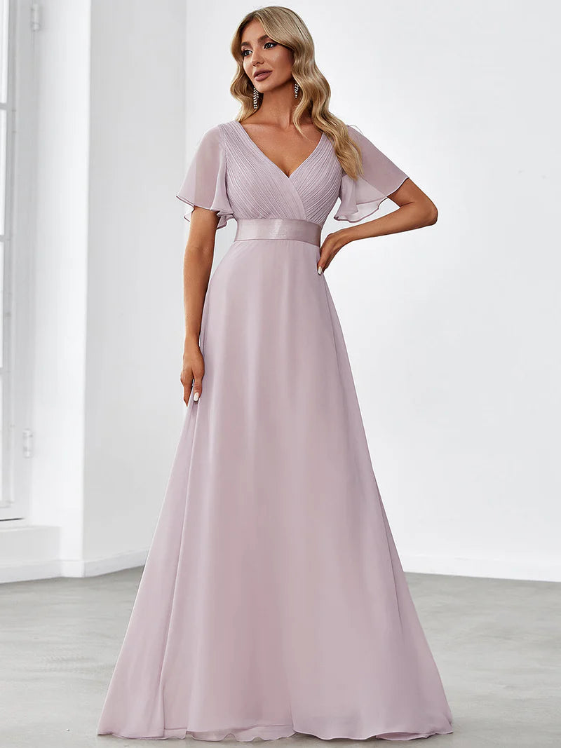Lilac formal dress in chiffon with satin band and short sleeves.