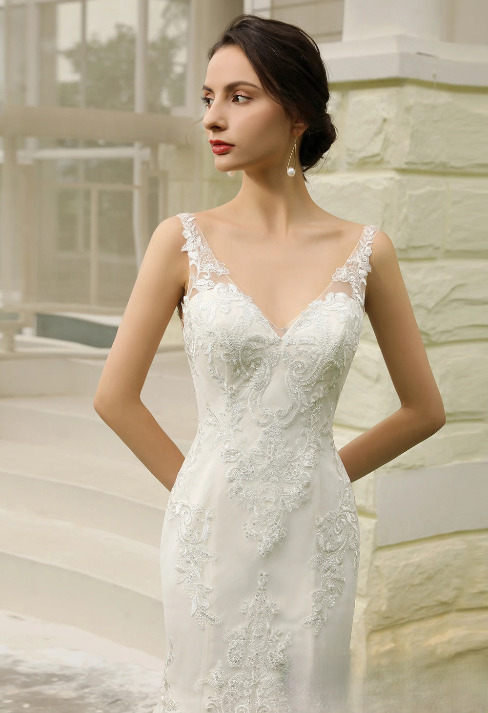 Mermaid lace applique over tulle wedding dress.