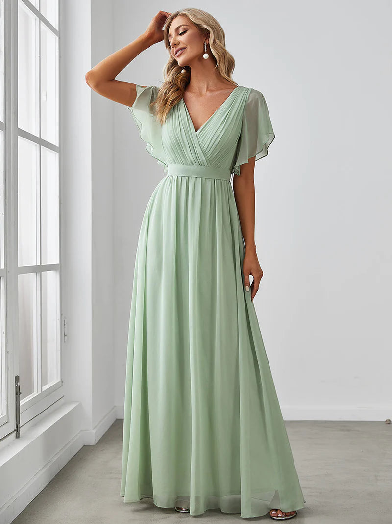 Mint green bridesmaid dress with v-neck and a-line.