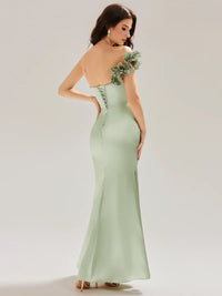 Mint green strapless formal dress with fishtail and ruffles.