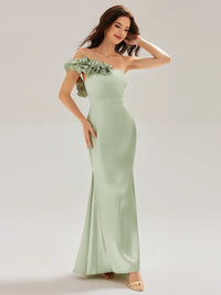 Mint green strapless formal dress with fishtail and ruffles.