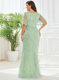 Mint Green Plus Size Mother of the bride or formal dress with tulle, sequins and lace ruffle sleeves.