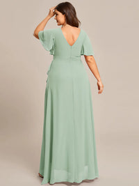 Mint green plus sized bridesmaid dress with high low ruffle and chiffon.