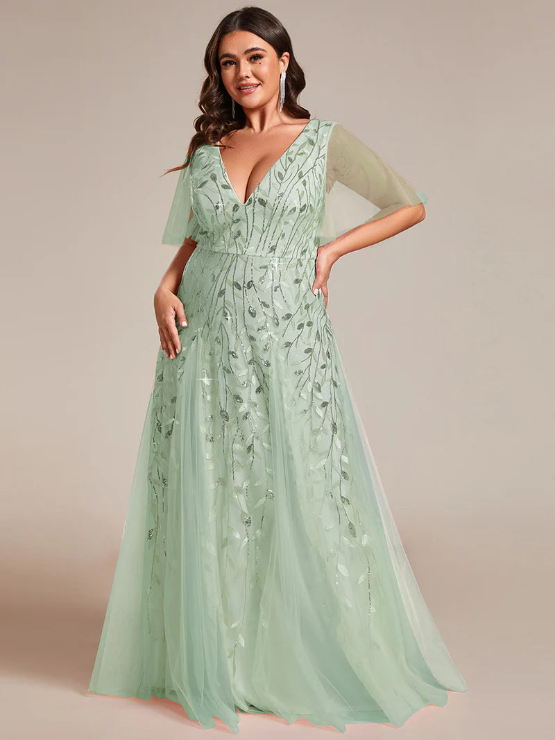 Mint Green plus size mother of the bride dress with short sleeves and flowing tulle.