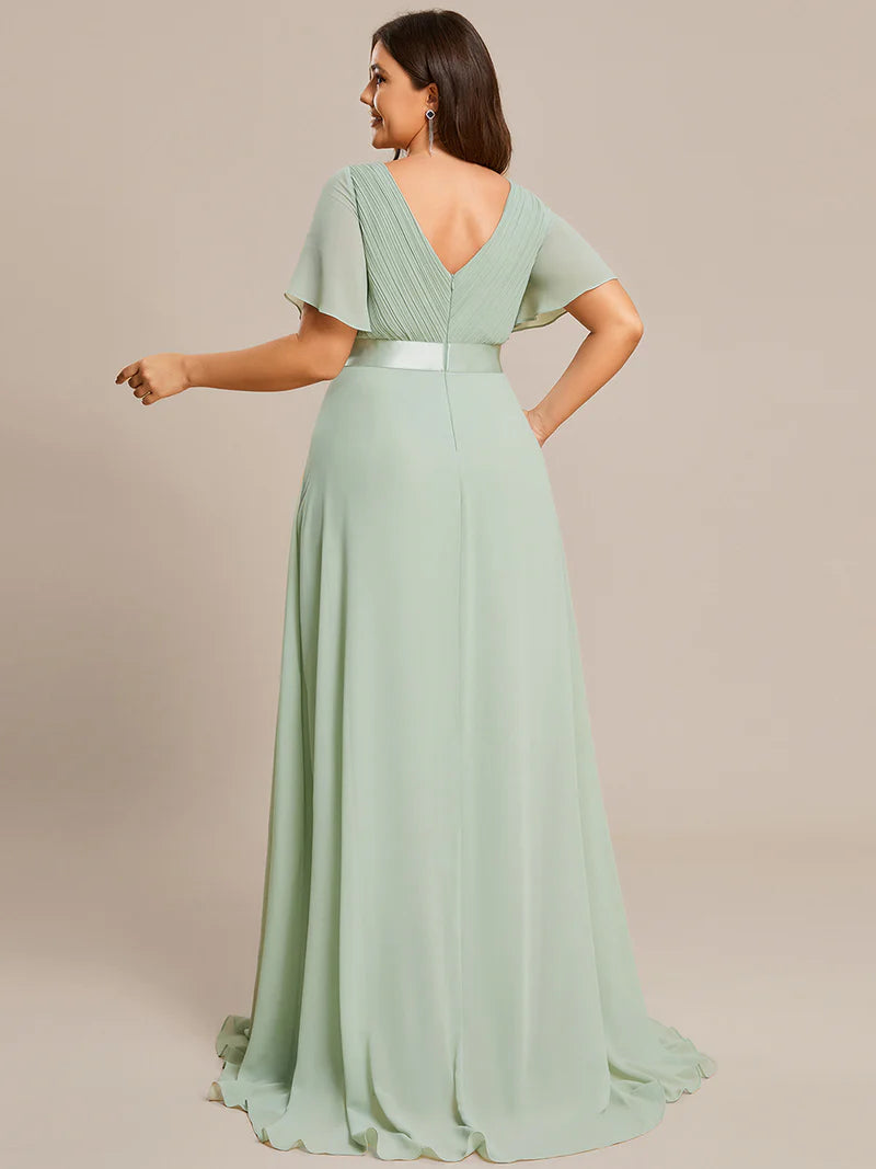 Mint Green plus size mother of the bride dress in chiffon with short sleeves and a satin band.