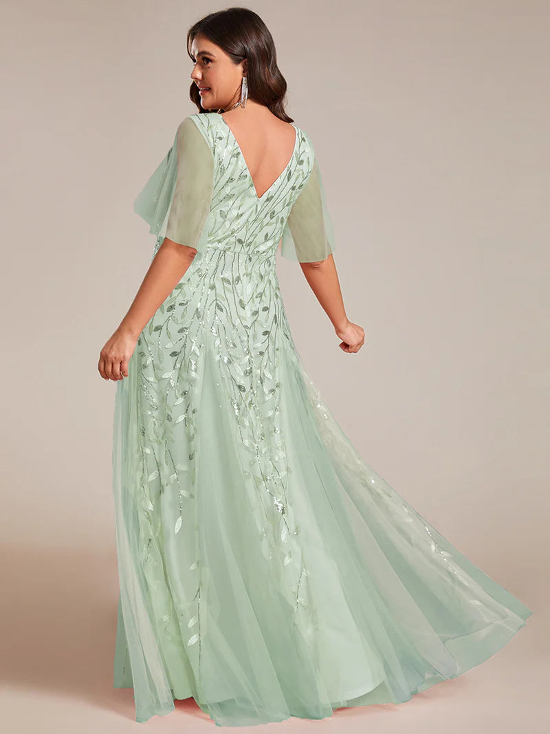 Mint Green plus size mother of the bride dress with short sleeves and flowing tulle.