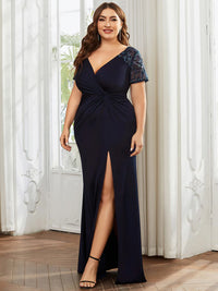 An elegant plus size mother of the bride long navy blue applique cap sleeved evening dress, ruched at the middle.