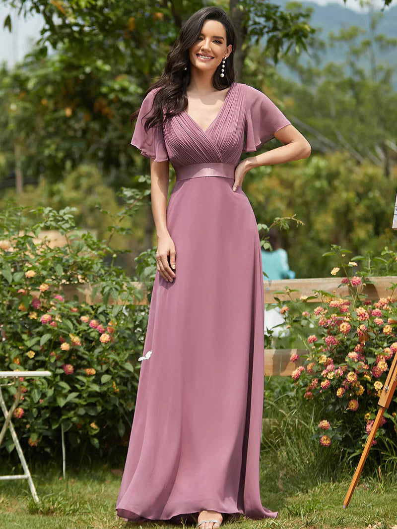 Orchid pink formal dress in chiffon with satin band and short sleeves.