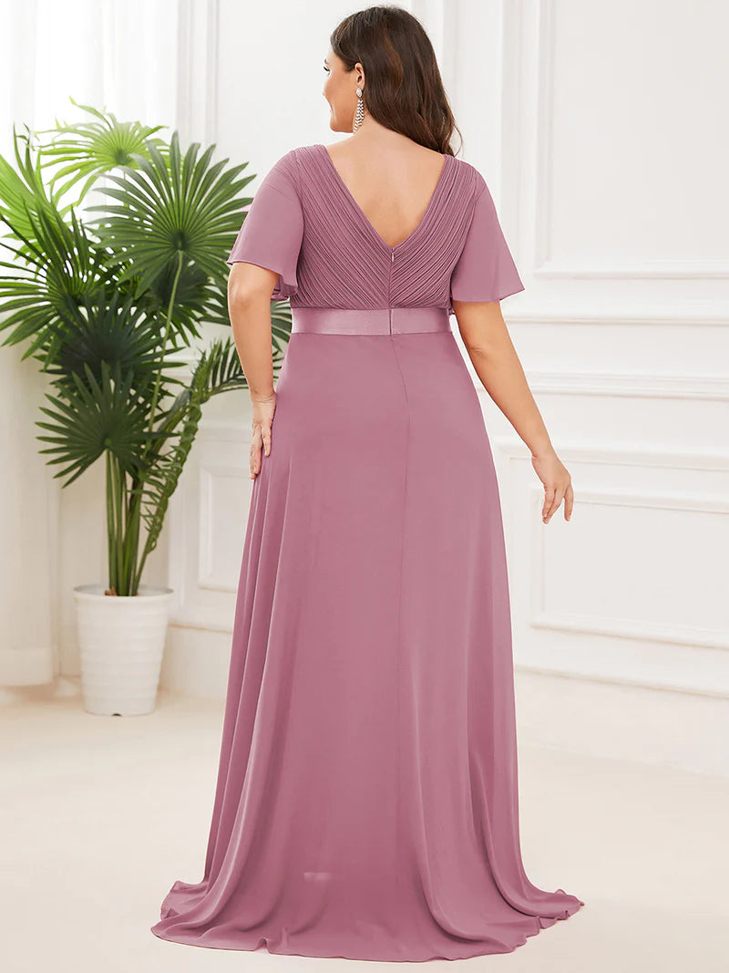 Orchid pink plus size bridesmaid dress or formal dress in chiffon with short sleeves and a satin band.