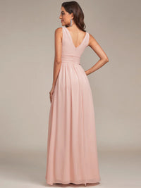 Pink bridesmaid dress with double v-neck and chiffon.