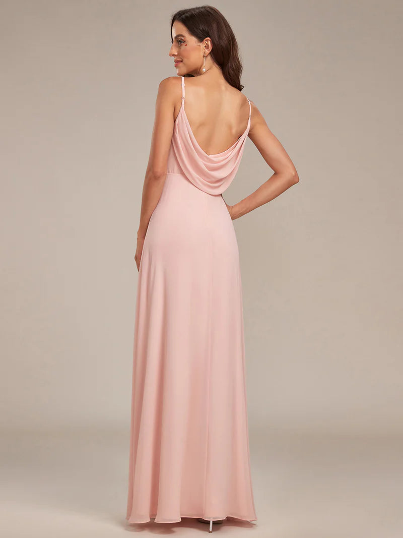 Sleeveless pink bridesmaid dress with spaghetti straps.
