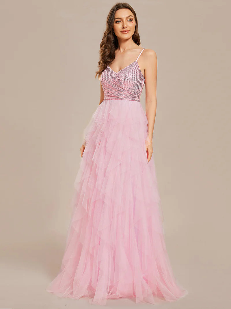 Pink formal layered tulle dress with sequin top and spaghetti straps.