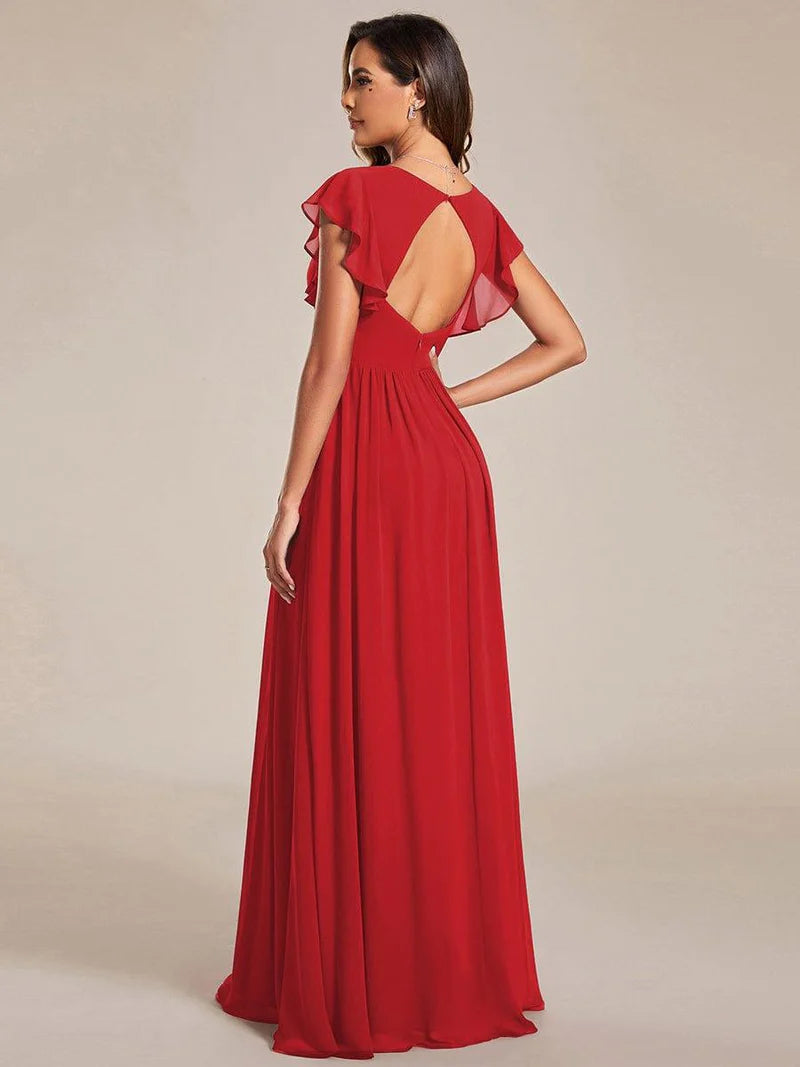 Red bridesmaid dress with ruffle sleeve and open back detail.