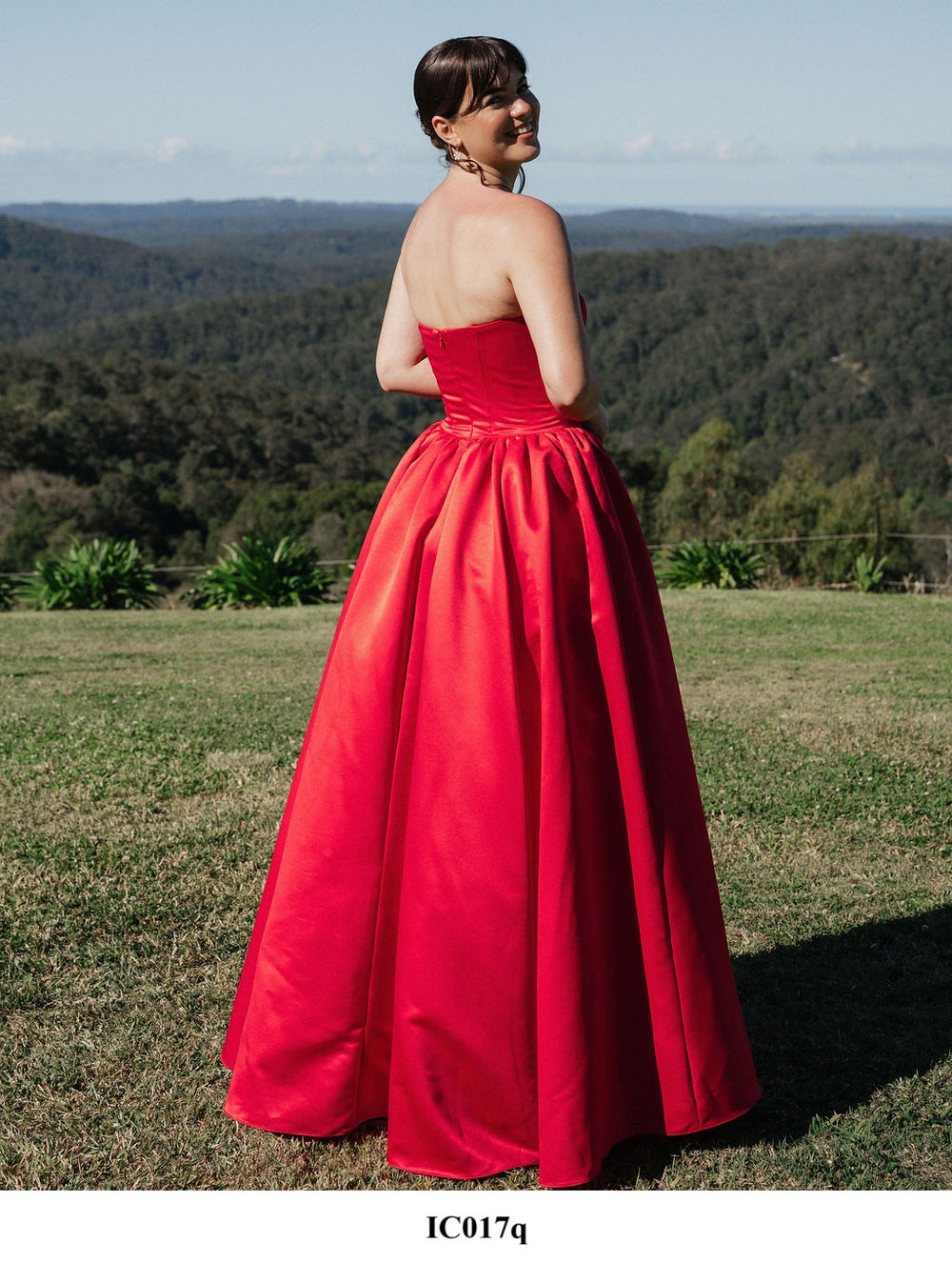Red strapless formal dress with tulle underskirt.