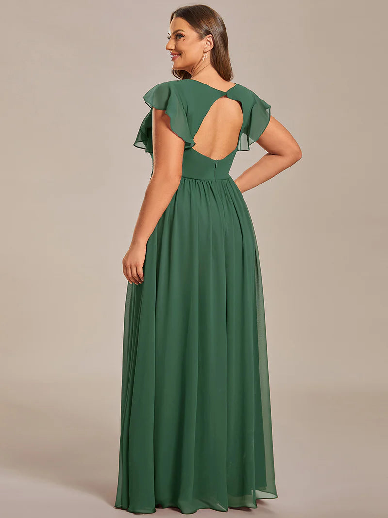 Sage green plus size bridesmaid dress with ruffle sleeve and open back detail.