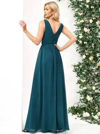 Teal bridesmaid dress with double v-neck and chiffon.