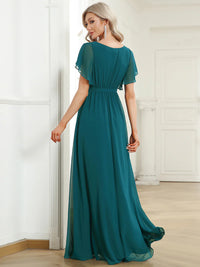 Teal bridesmaid dress with v-neck and a-line.