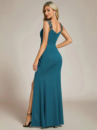 Teal formal dress with glitter and split front.