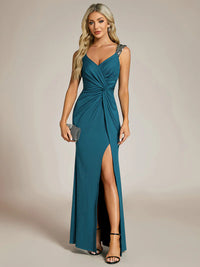 Teal formal dress with glitter and split front.