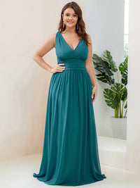 Teal plus sized bridesmaid dress with double v-neck and chiffon.